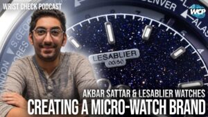 Akbar, founder of Theer, discusses his journey from watch collector to watchmaker on the Wrist Check Podcast, showcasing the Travel Graph world timer with a smoked ruby dial.